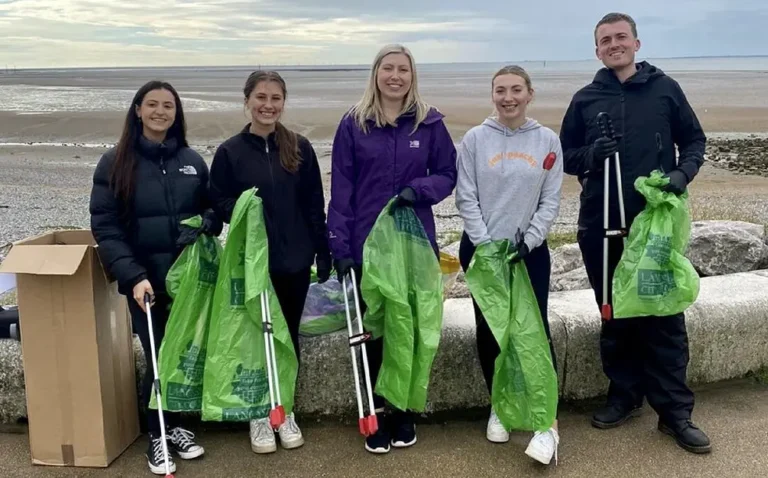 Harrison Drury joins forces with local business partners to clean up the Morecambe coastline